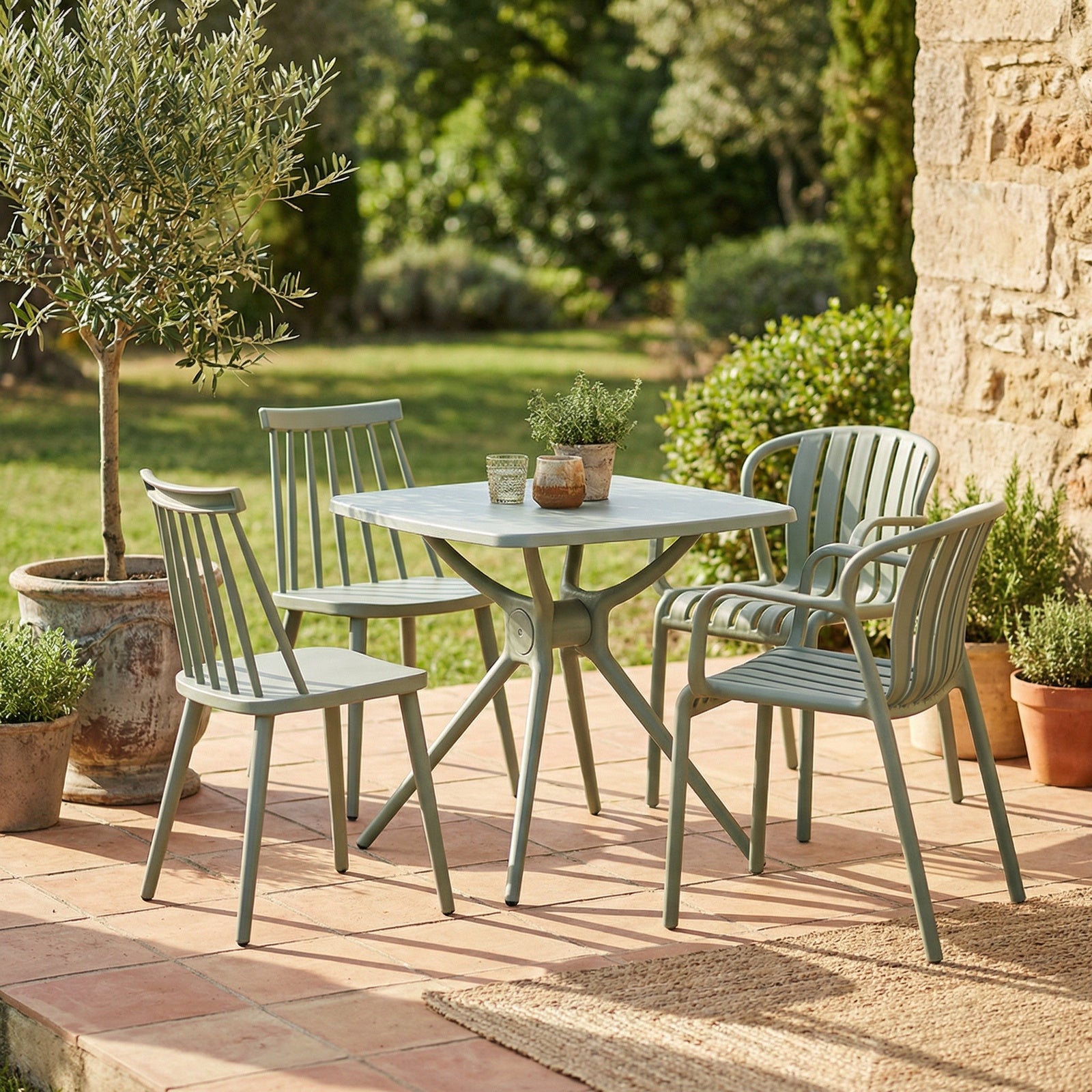 Hill Interiors Alto French grey plastic dining table, placed in a modern dining setting