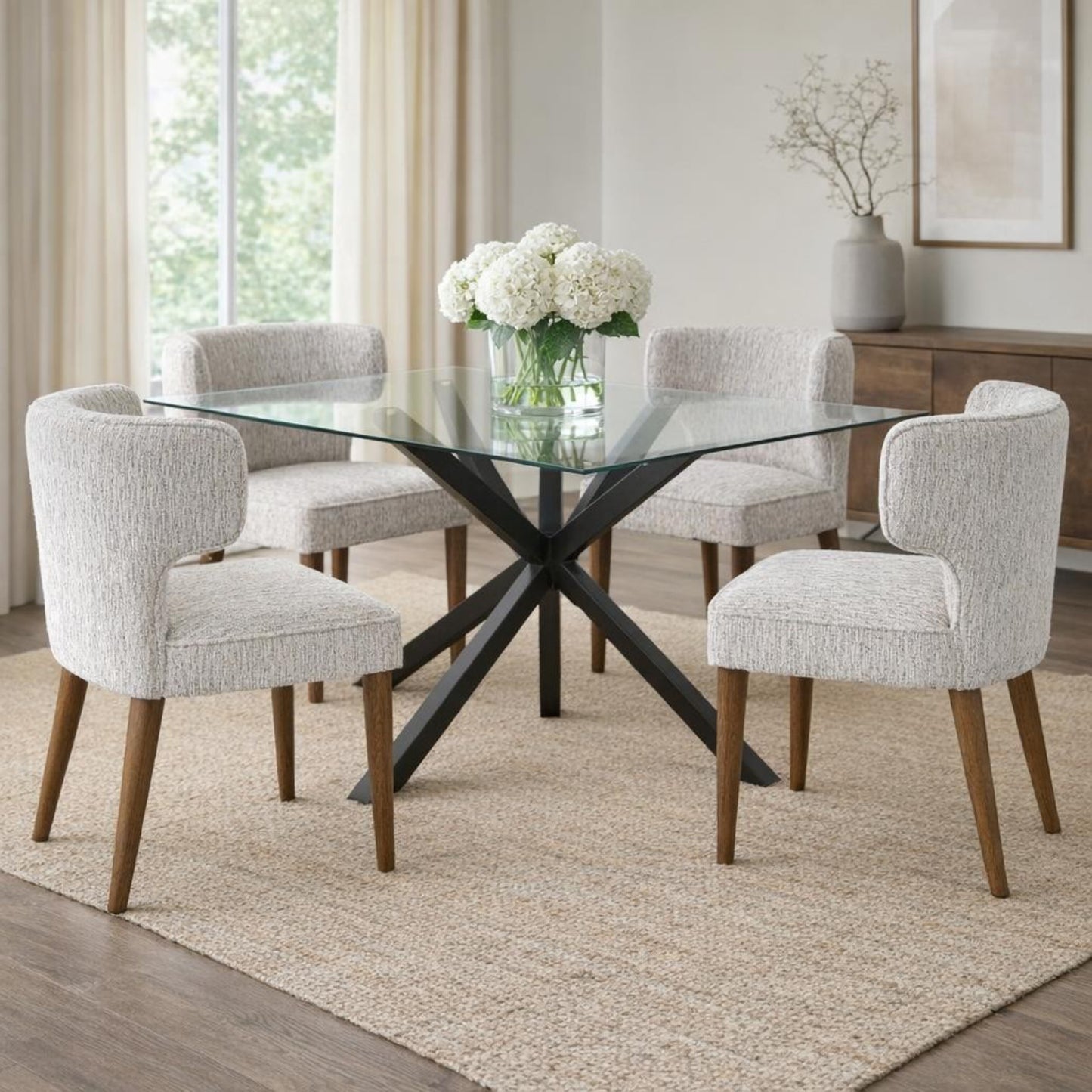Hill Interiors Avia mist grey fabric dining chair with wooden frame, placed in a contemporary dining setting