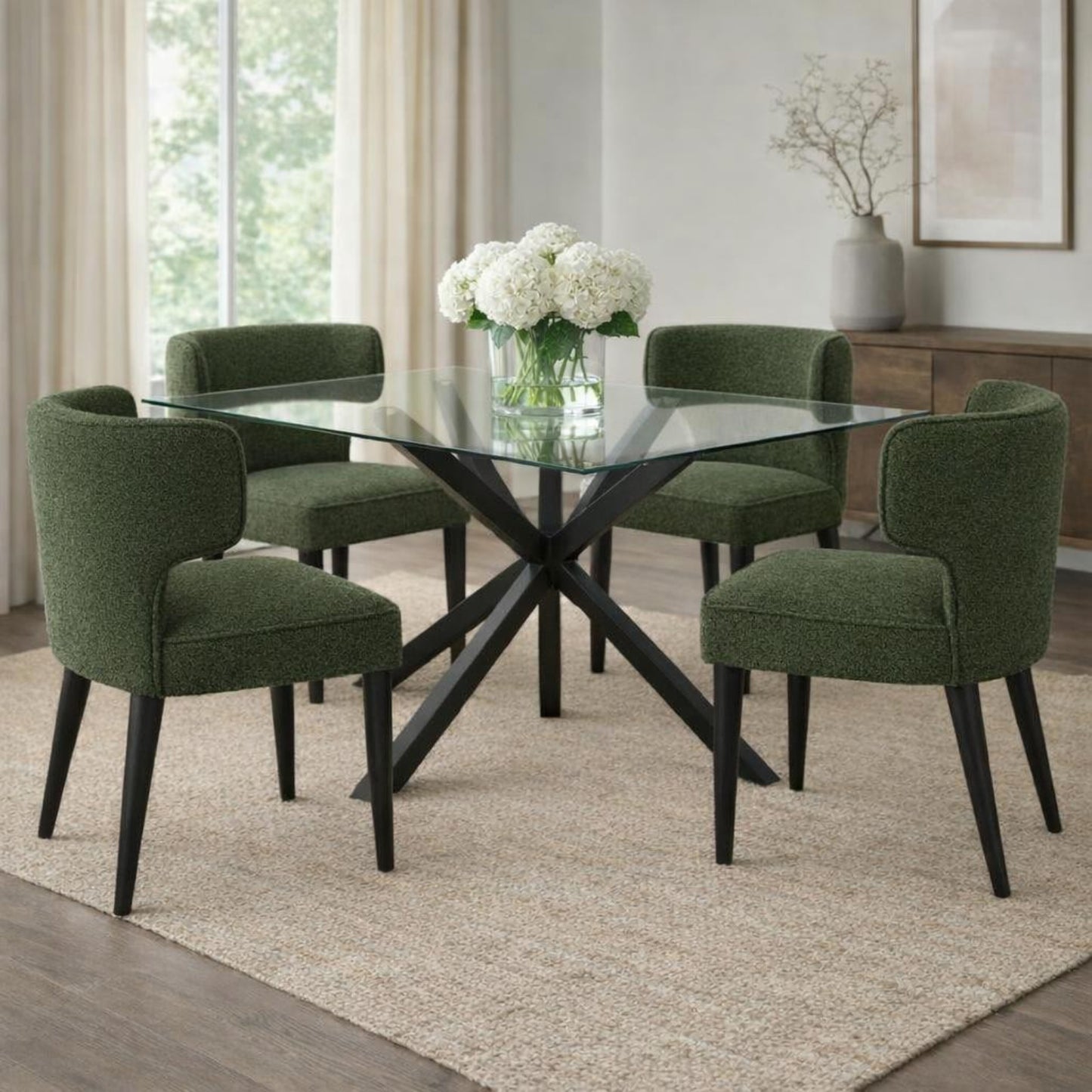 Hill Interiors Avia moss green fabric dining chair with wooden frame, placed in a contemporary dining setting