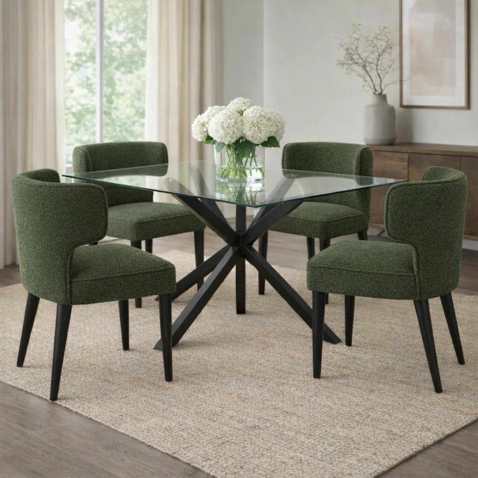 Hill Interiors Avia moss green fabric dining chair with wooden frame, placed in a contemporary dining setting
