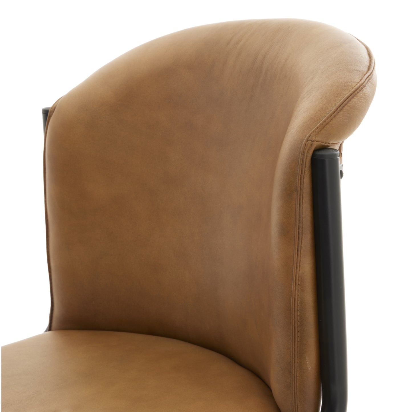Hill Interiors Billy curved leather dining chair in a contemporary dining room with wooden table and industrial lighting