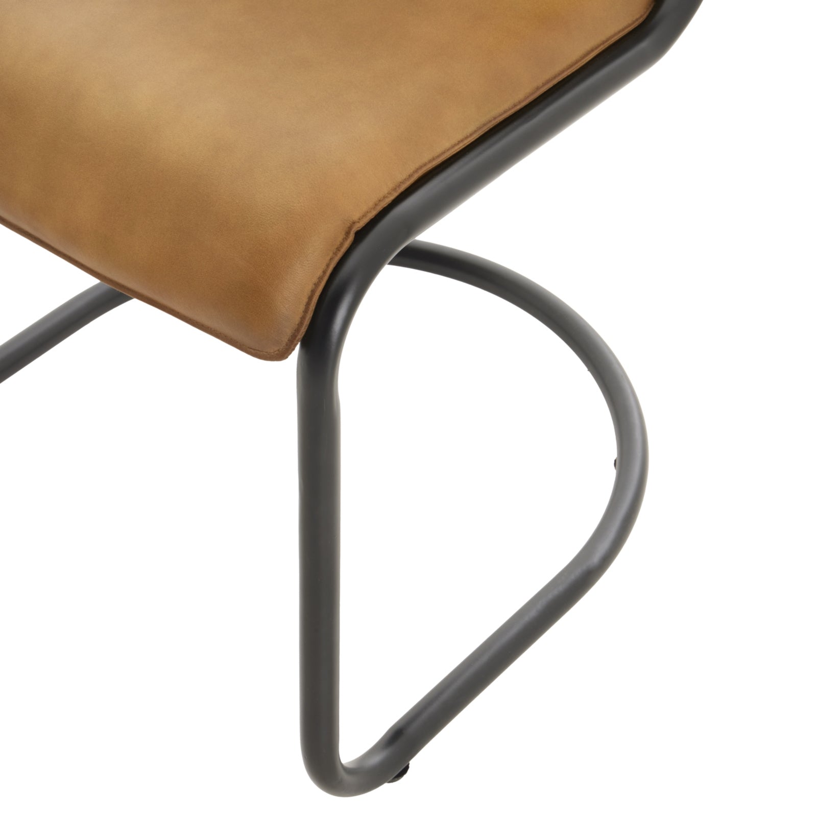 Hill Interiors Billy curved leather dining chair showing the seat cushion thickness and overall proportions