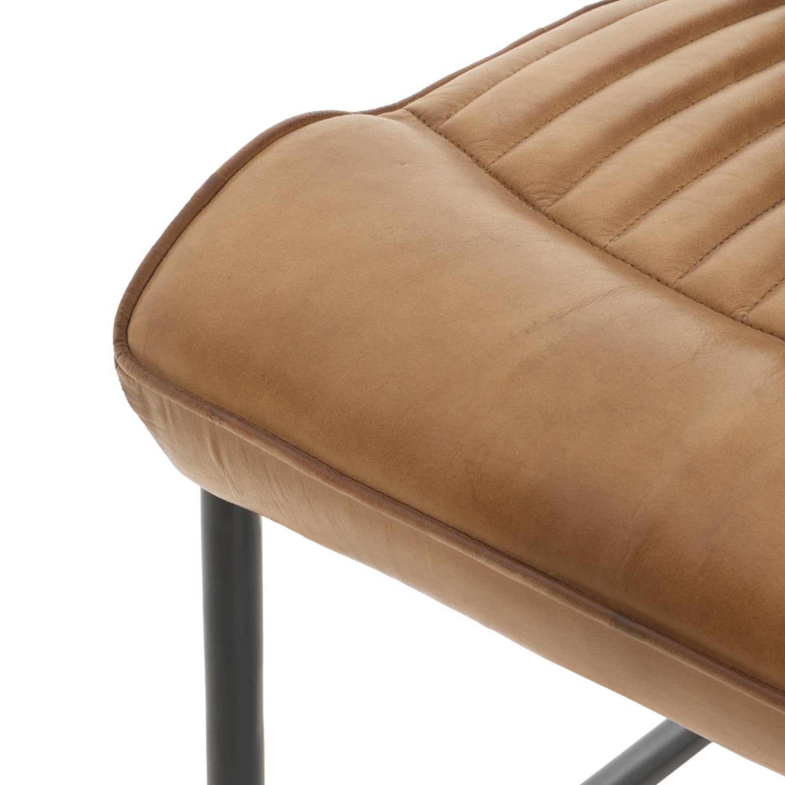 	Hill Interiors Billy leather dining chair from behind showing the black metal frame and channeled backrest