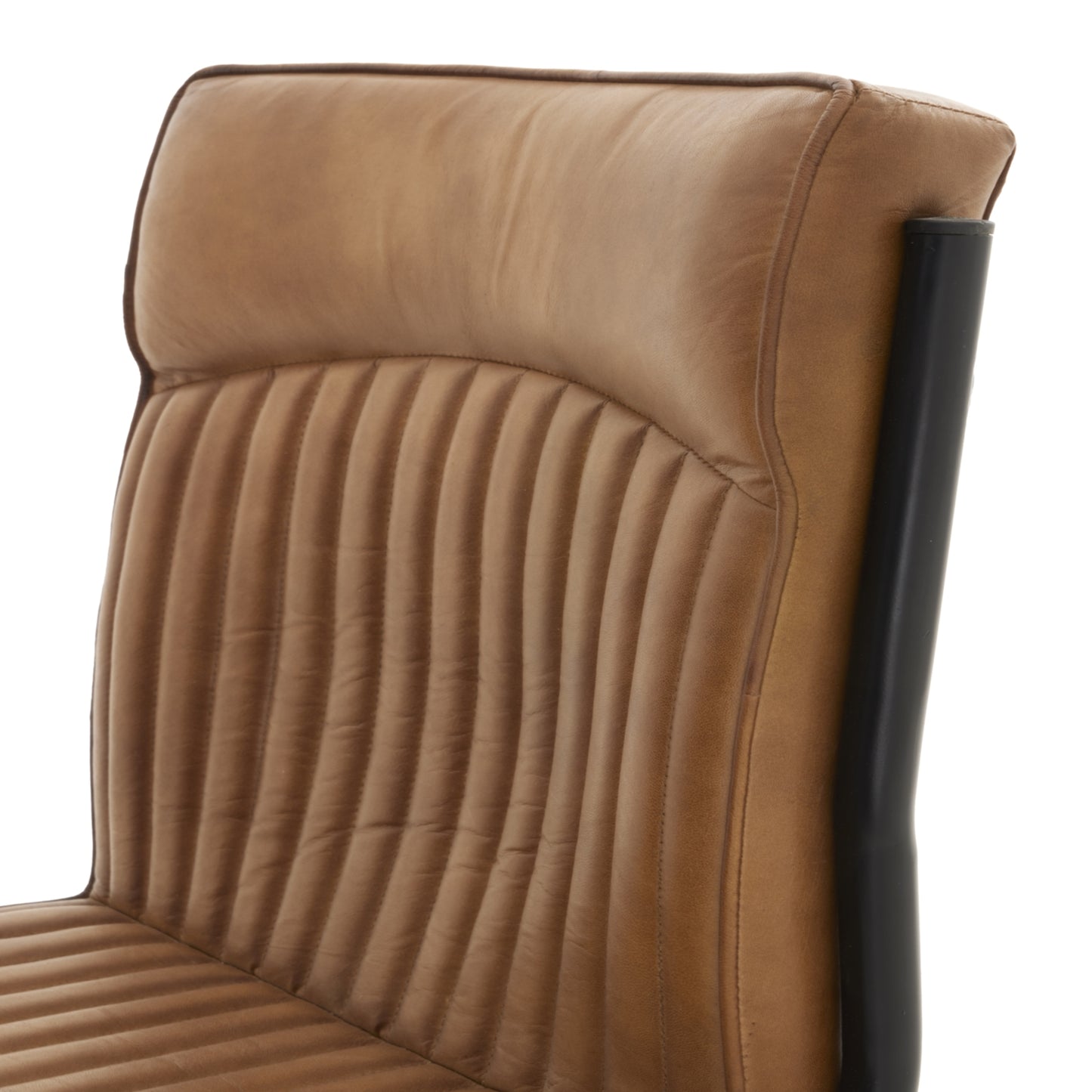 	Hill Interiors Billy leather dining chair in a contemporary dining room with wooden table and industrial lighting