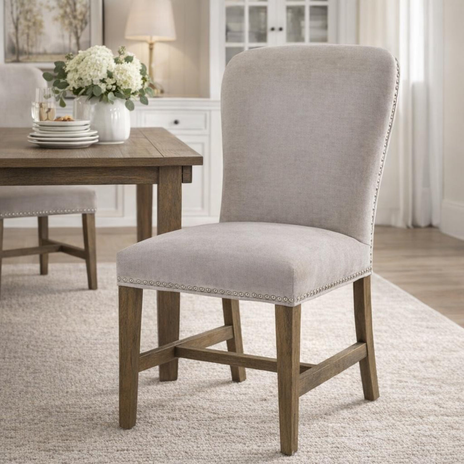 	Hill Interiors Cobham grey dining chair showing seat cushion thickness and overall proportions