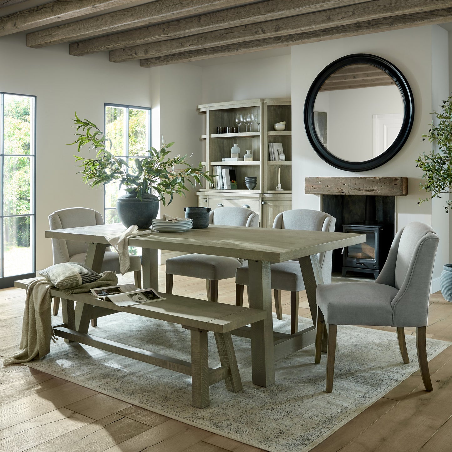 	Hill Interiors Compton grey dining chair in a bright contemporary dining room with wooden table