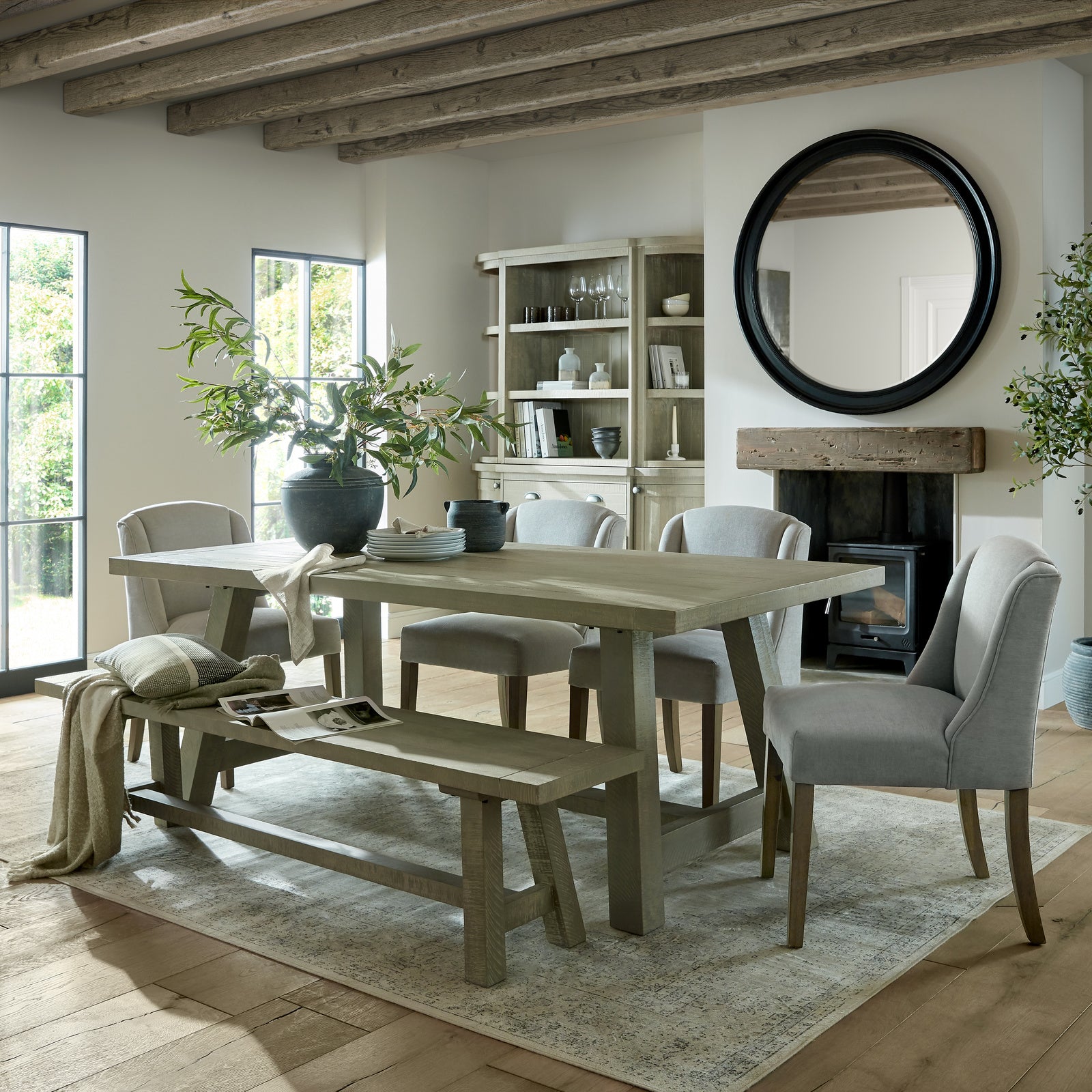 	Hill Interiors Compton grey dining chair in a bright contemporary dining room with wooden table