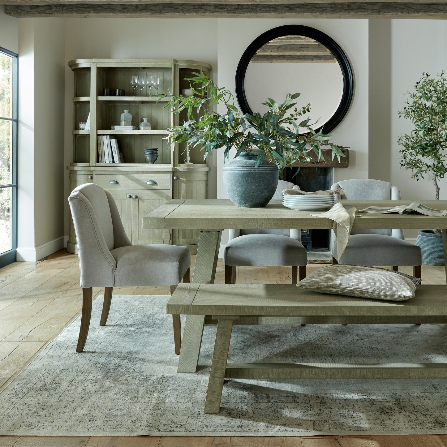 	Hill Interiors Compton grey dining chair showing the plush seat cushion thickness and overall proportions
