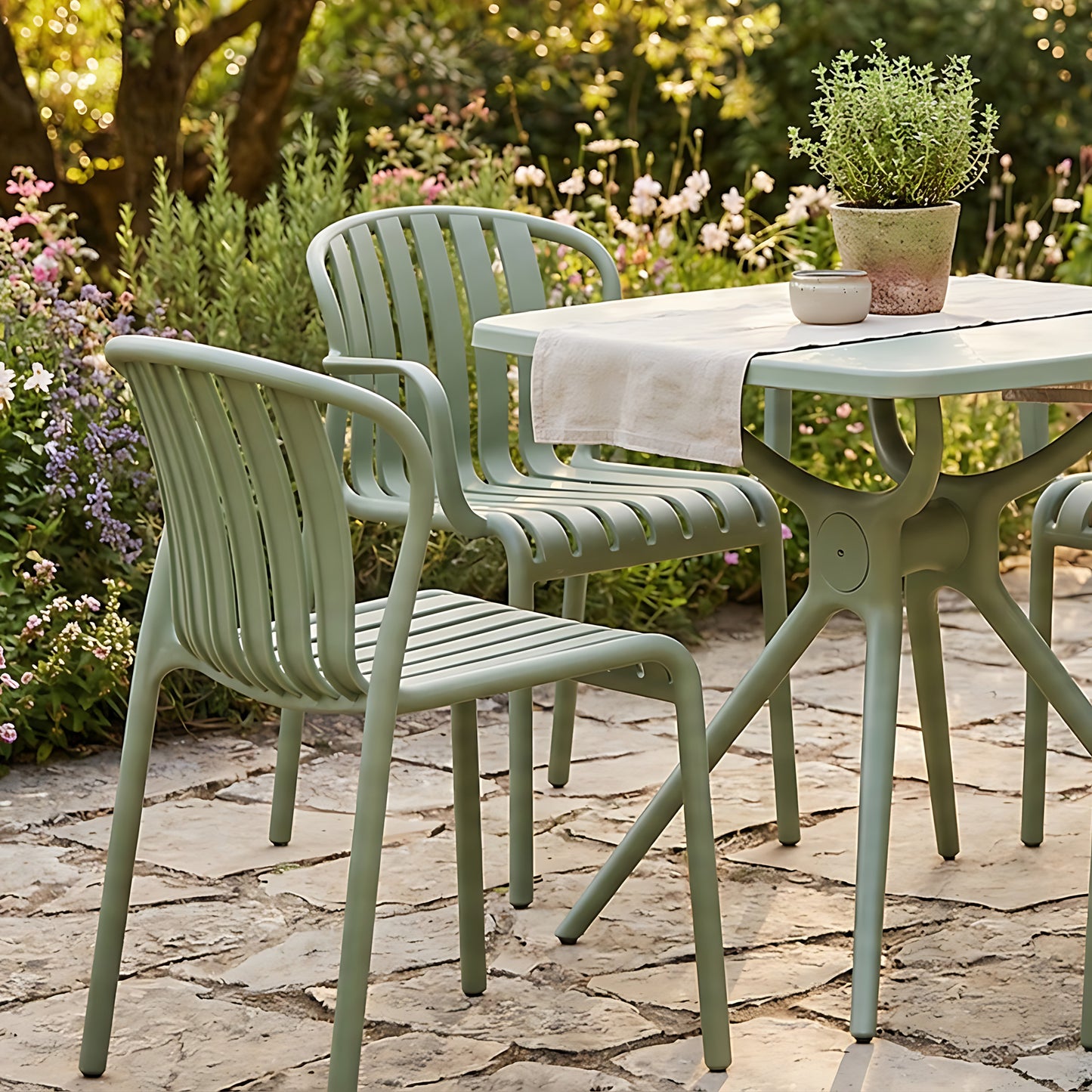 Hill Interiors Echo French grey dining chair in a modern dining room with wooden table