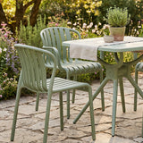 Hill Interiors Echo French grey dining chair in a modern dining room with wooden table