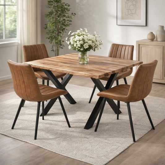 Hill Interiors Malmo tan swivel dining chair with channel-stitched backrest and black metal legs, placed in a modern dining setting