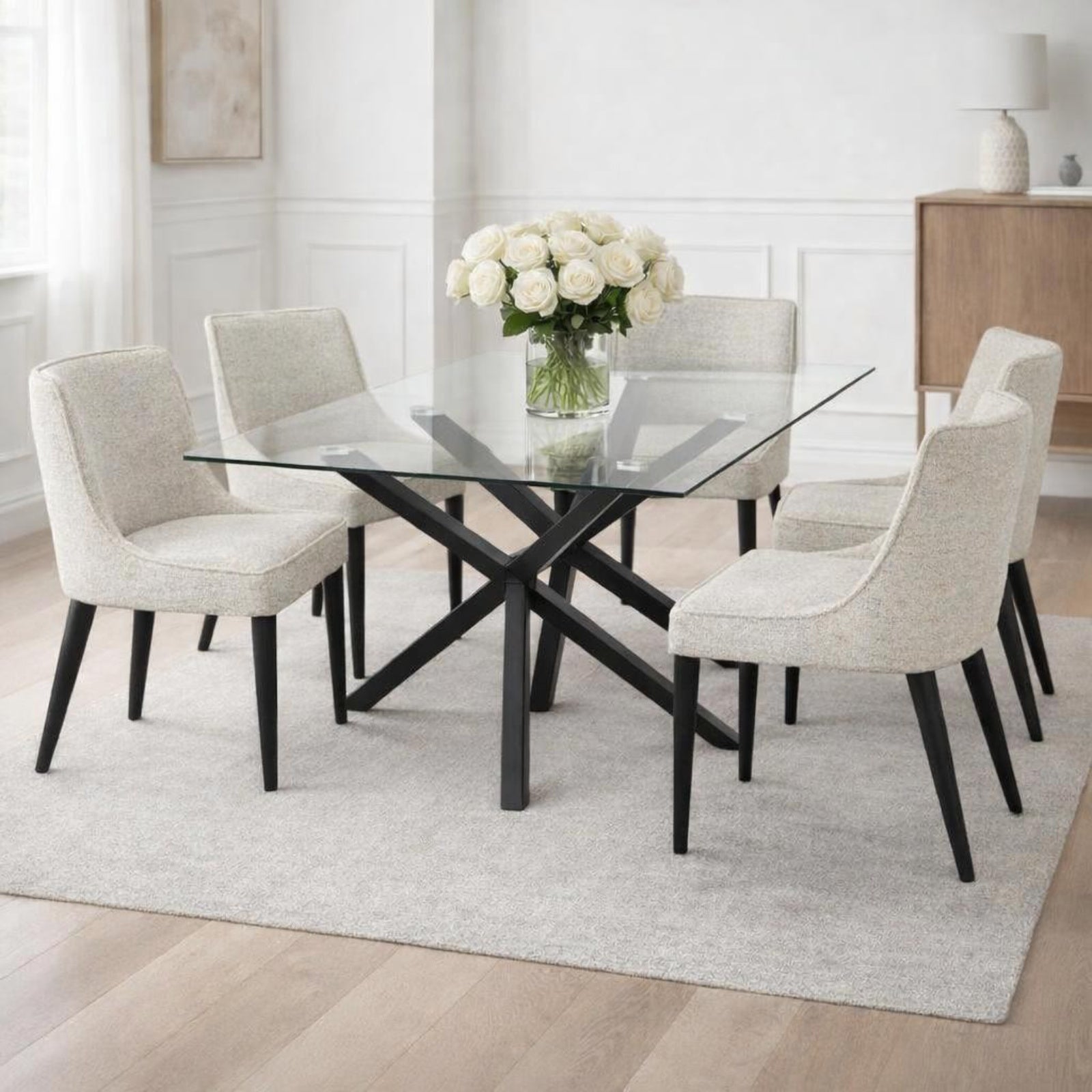 Hill Interiors Monza rectangular glass dining table with chrome base, placed in a modern dining setting