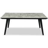 	Hill Interiors Nivara rectangular dining table with wooden top and black base, placed in a modern dining setting