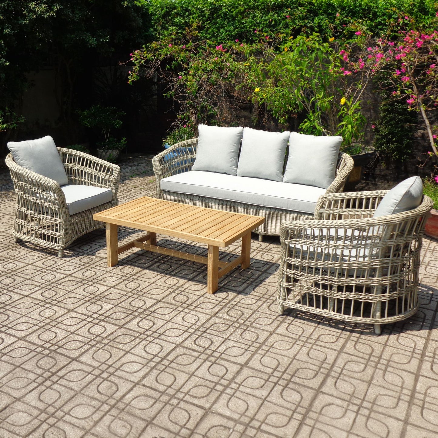 	Hill Interiors Palma Collection beige outdoor set in a modern garden setting
