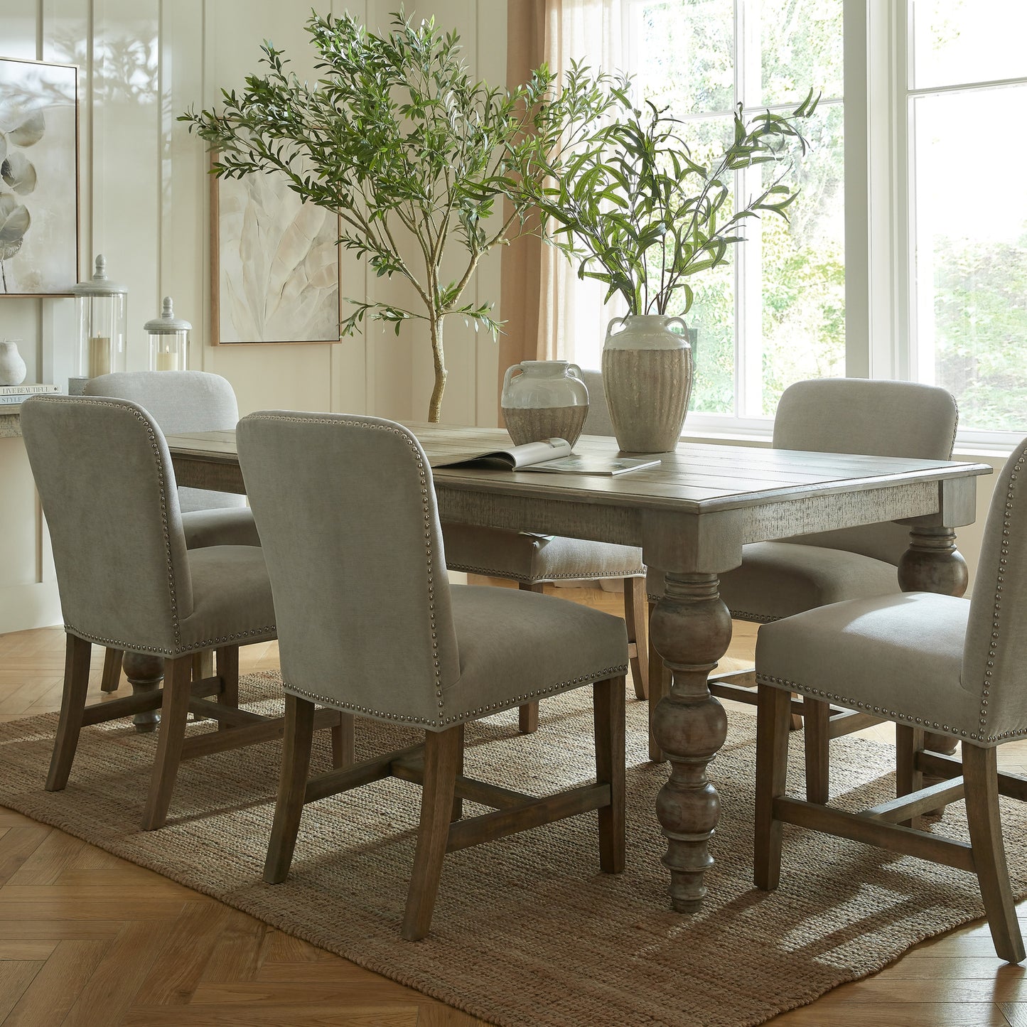	Hill Interiors Rutland Collection rectangular dining table with premium wood finish, placed in an elegant dining setting