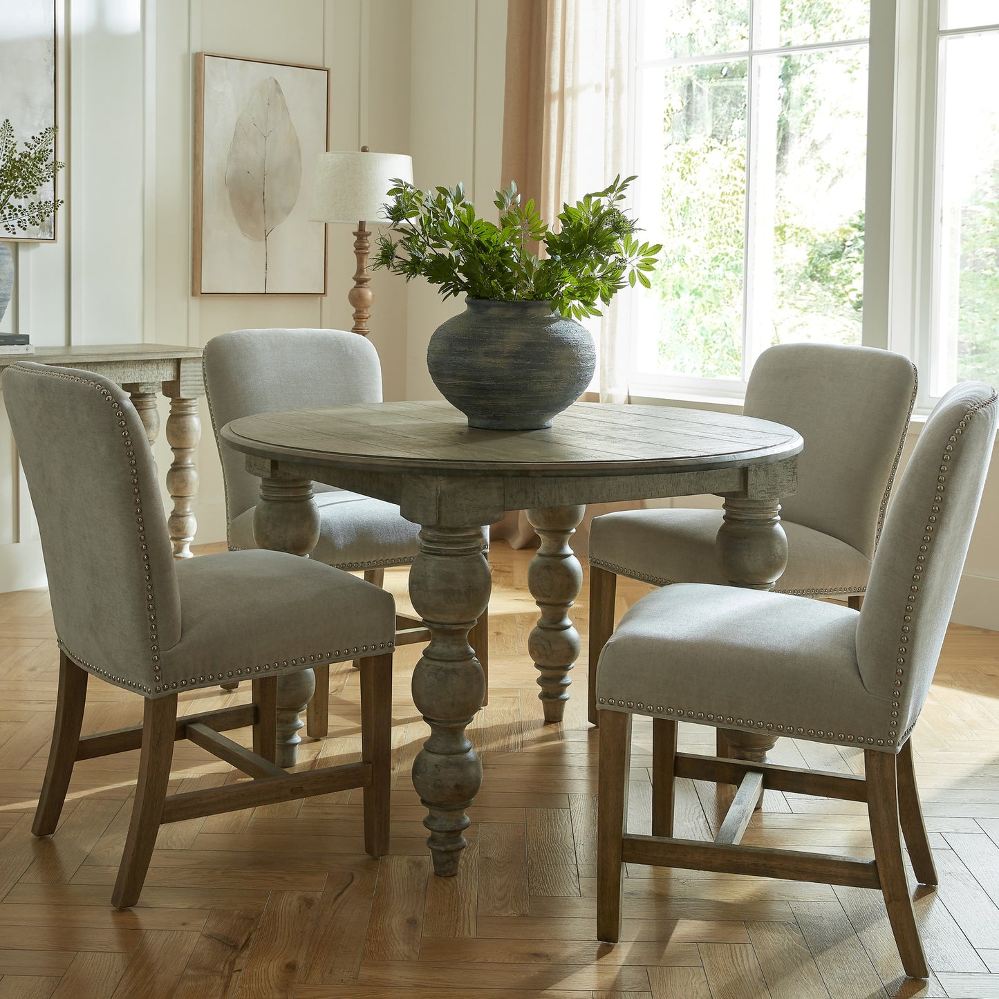 Side view of Hill Interiors Rutland Collection round dining table showing the beautiful wood grain and finish