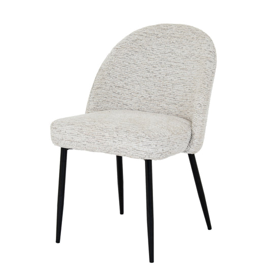 Hill Interiors Sorelle white fabric dining chair with metal frame, placed in a contemporary dining setting
