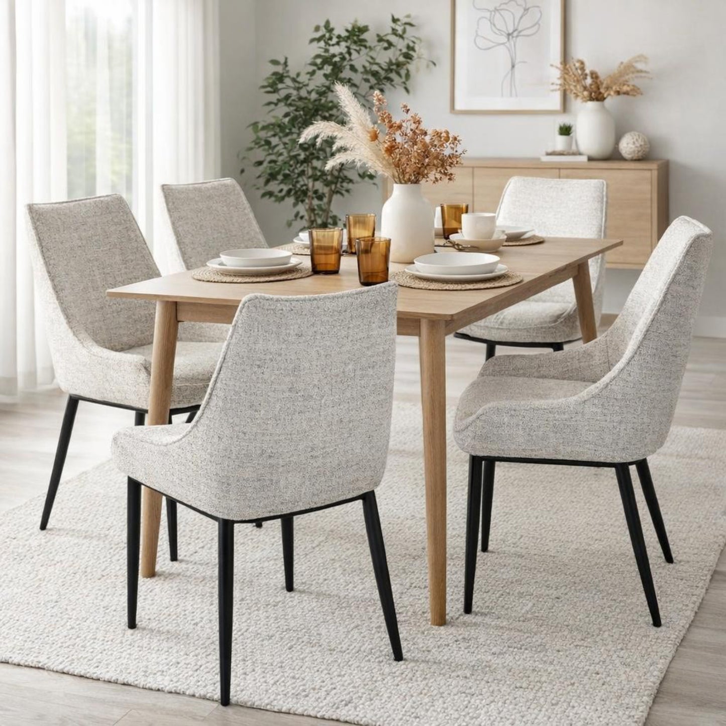 Hill Interiors Zephra white fabric dining chair with metal frame, placed in a contemporary dining setting