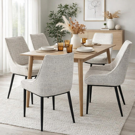 Hill Interiors Zephra white fabric dining chair with metal frame, placed in a contemporary dining setting