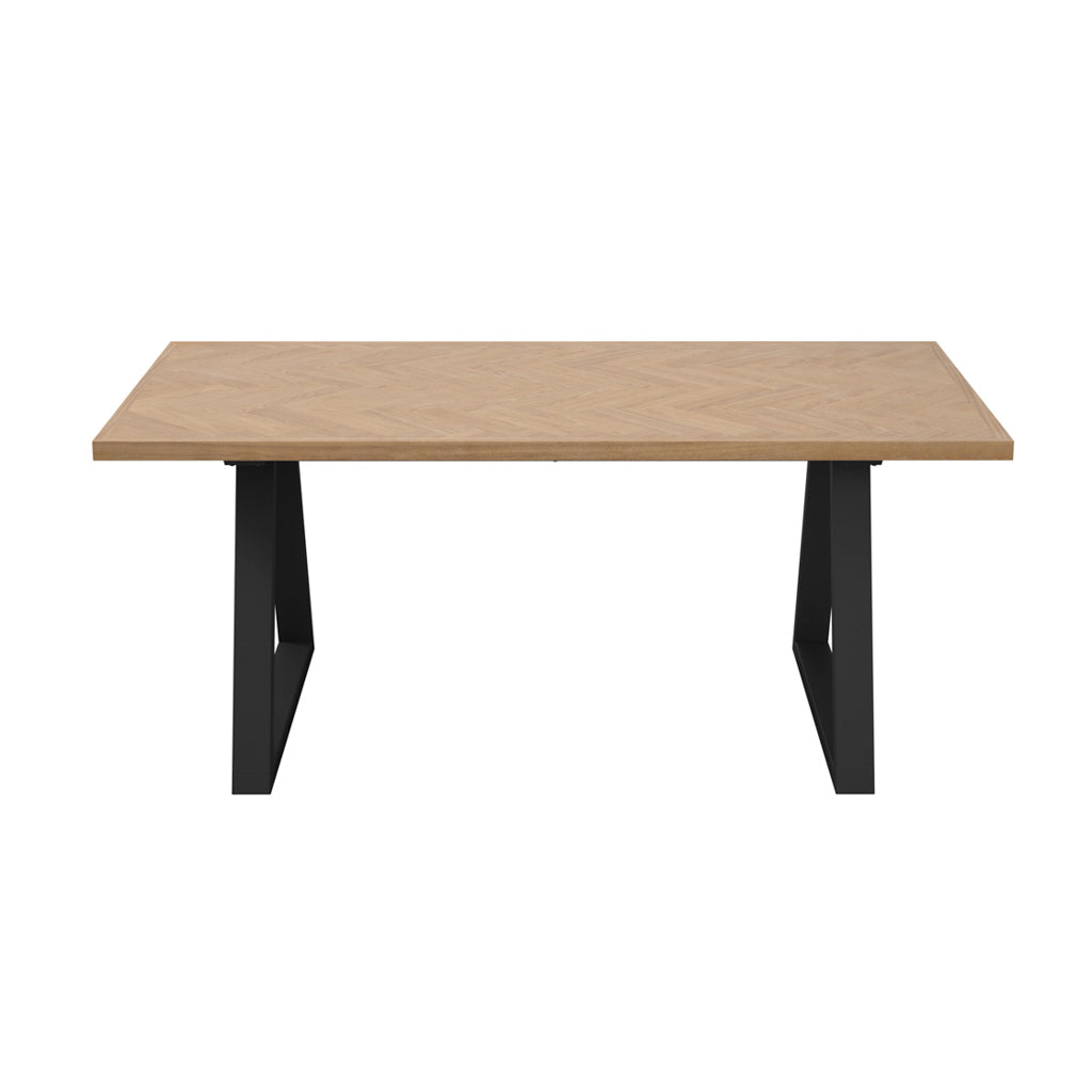 LPD Furniture Hyde natural wood herringbone dining table with black metal legs in a modern dining setting