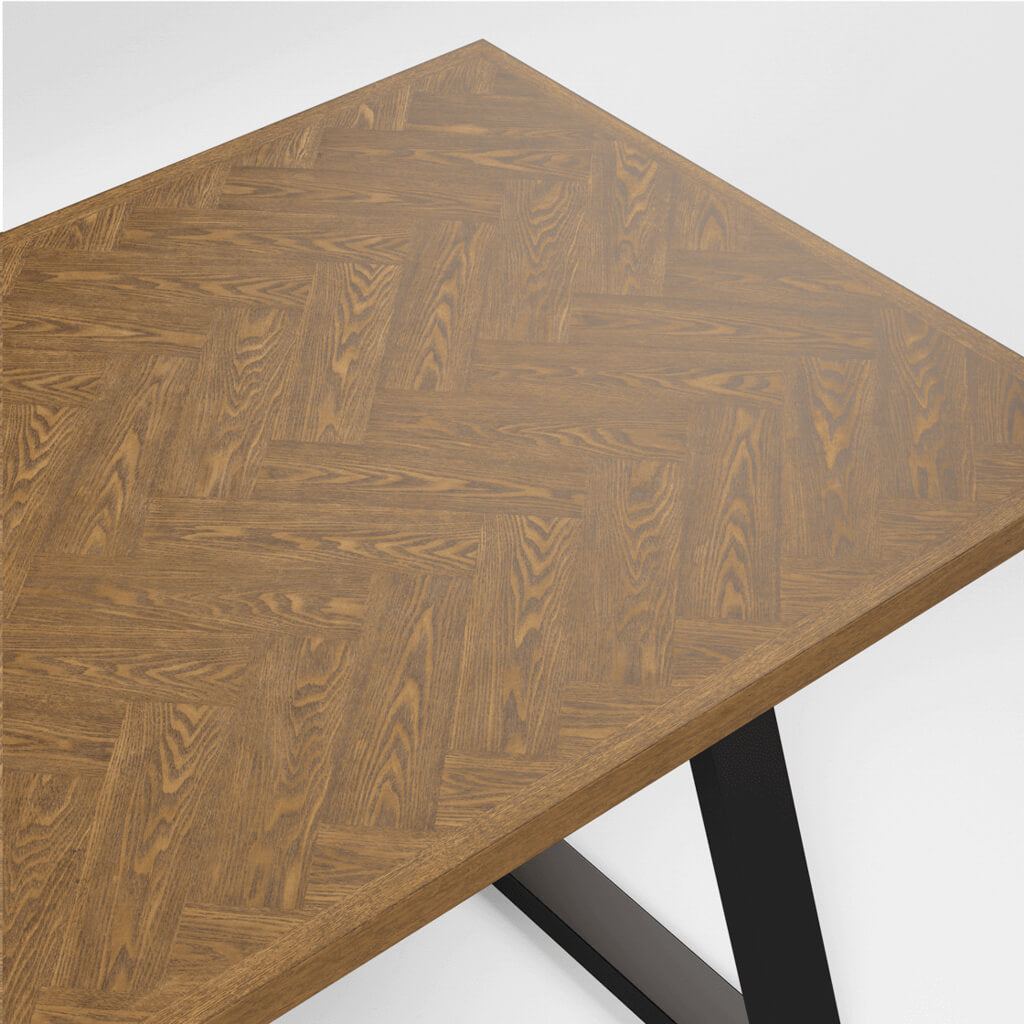 LPD Furniture Hyde whiskey wood herringbone dining table with black metal legs in a modern dining setting