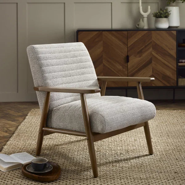 Ivy sand chenille tweed armchair in a modern living room or reading nook setting