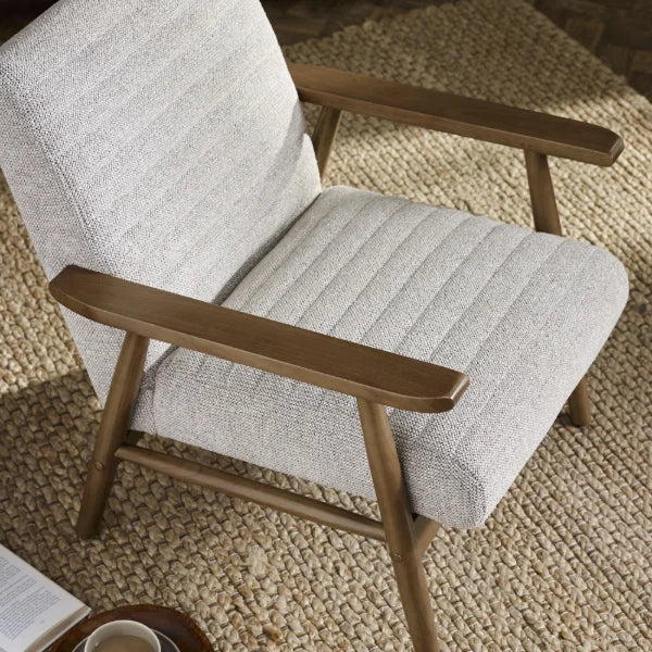 Ivy sand chenille tweed armchair in a modern living room or reading nook setting