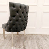 Furnish365 Kensington dark grey velvet dining chair with deep buttoned back and chrome studs in a modern dining setting