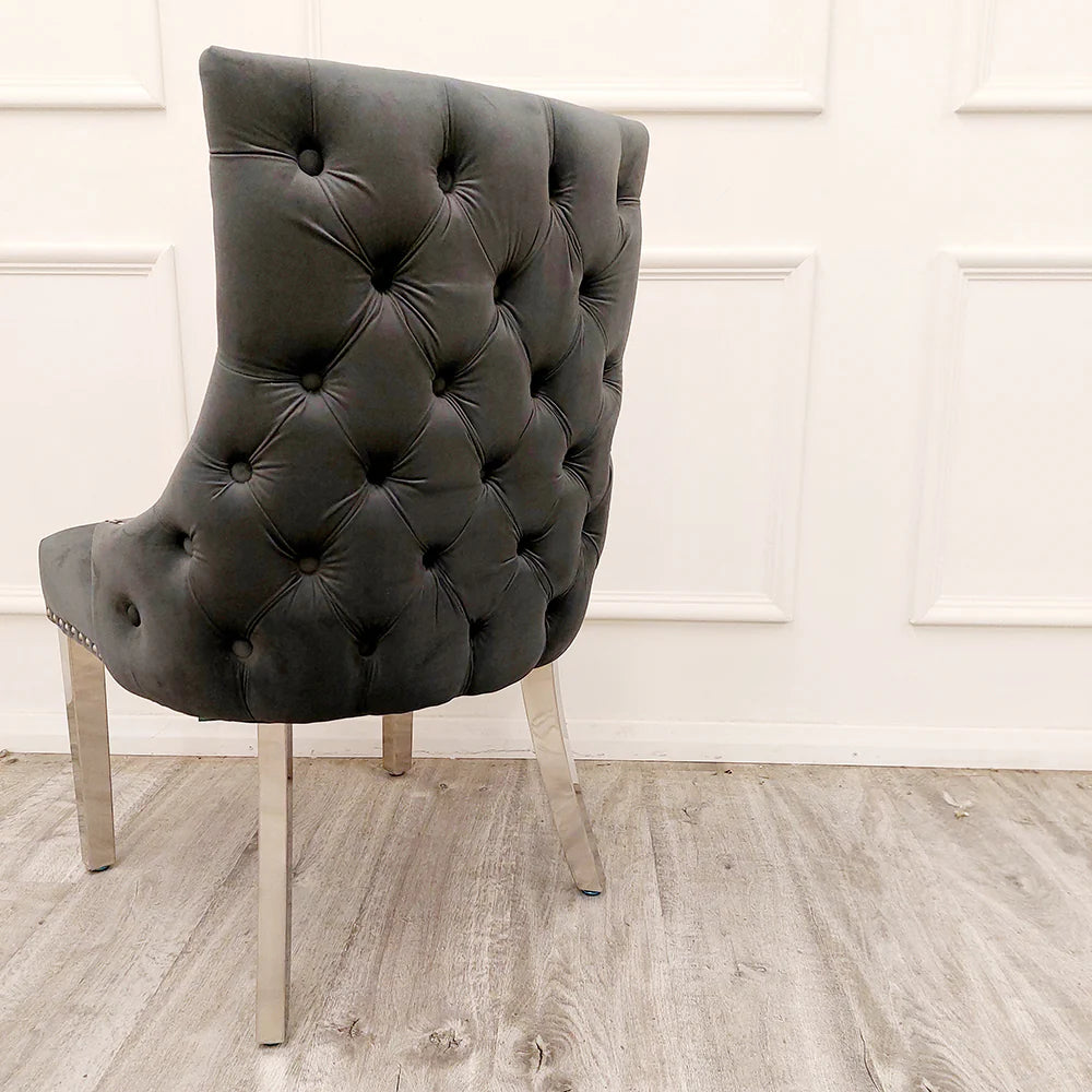 Furnish365 Kensington dark grey velvet dining chair with deep buttoned back and chrome studs in a modern dining setting