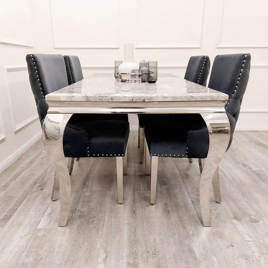 Furnish365 Kensington dark grey velvet dining chair with deep buttoned back and chrome studs in a modern dining setting