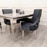 Furnish365 Kensington dark grey velvet dining chair with deep buttoned back and chrome studs in a modern dining setting