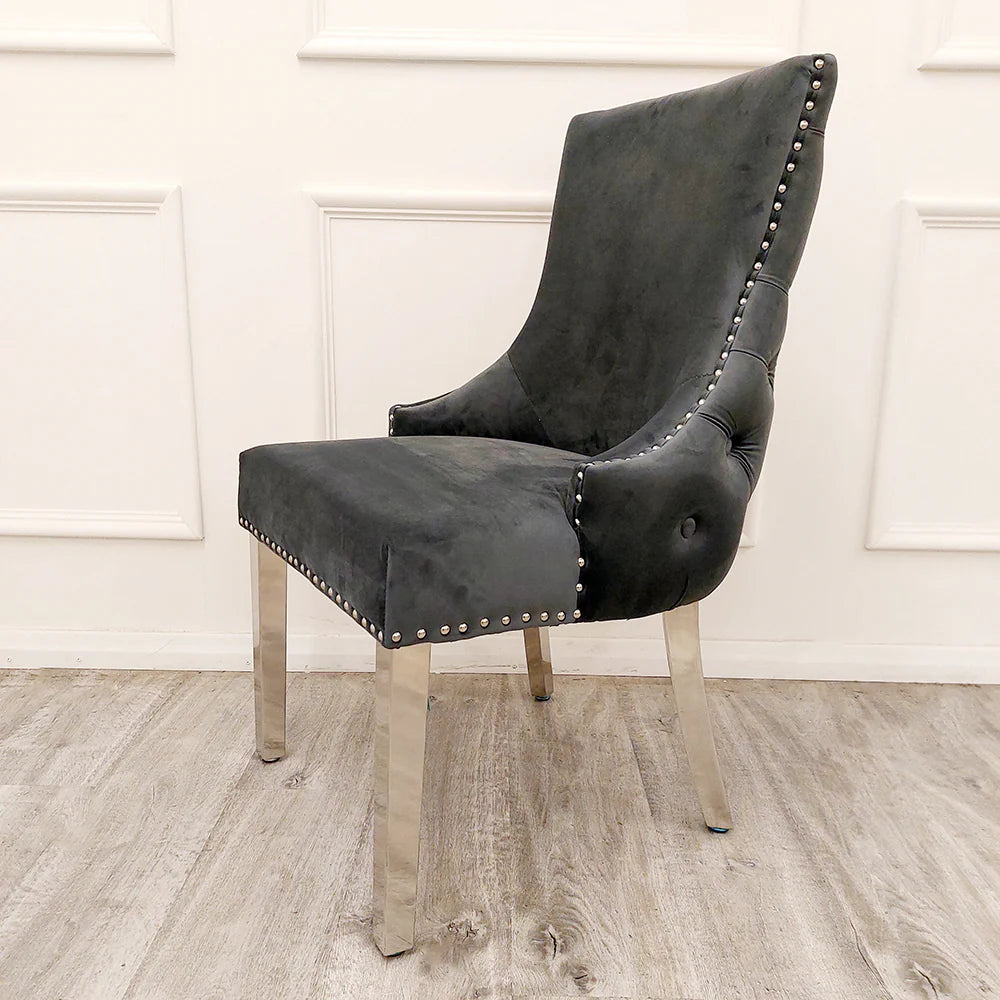 Furnish365 Kensington dark grey velvet dining chair with deep buttoned back and chrome studs in a modern dining setting