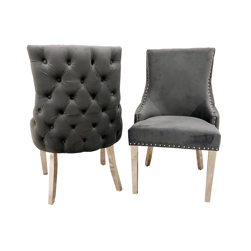 Furnish365 Kensington dark grey velvet dining chair with deep buttoned back and chrome studs in a modern dining setting
