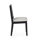Julian Bowen Knoxley set of 2 black oak rattan back dining chairs with fabric seats in a modern dining setting