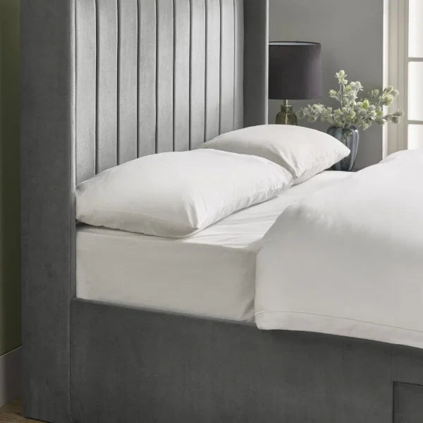 Leila bottle green king bed with vertical panelled headboard in a modern bedroom setting