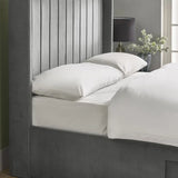 Leila bottle green king bed with vertical panelled headboard in a modern bedroom setting