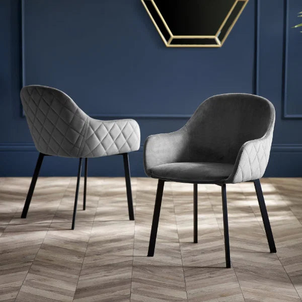 Lima set of 2 grey velvet dining chairs with diamond stitching in a modern dining room setting