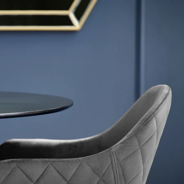 Lima set of 2 grey velvet dining chairs with diamond stitching in a modern dining room setting