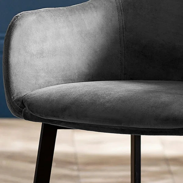 Lima set of 2 grey velvet dining chairs with diamond stitching in a modern dining room setting