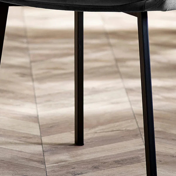 Lima set of 2 grey velvet dining chairs with diamond stitching in a modern dining room setting