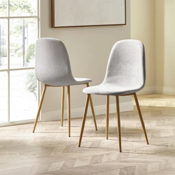 Lottie set of 4 linen chenille dining chairs in a modern dining room setting
