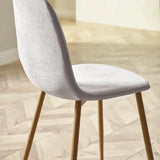 Lottie set of 4 linen chenille dining chairs in a modern dining room setting
