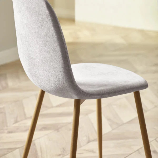 Lottie set of 4 linen chenille dining chairs in a modern dining room setting
