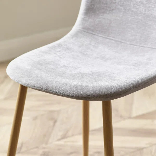 Lottie set of 4 linen chenille dining chairs in a modern dining room setting