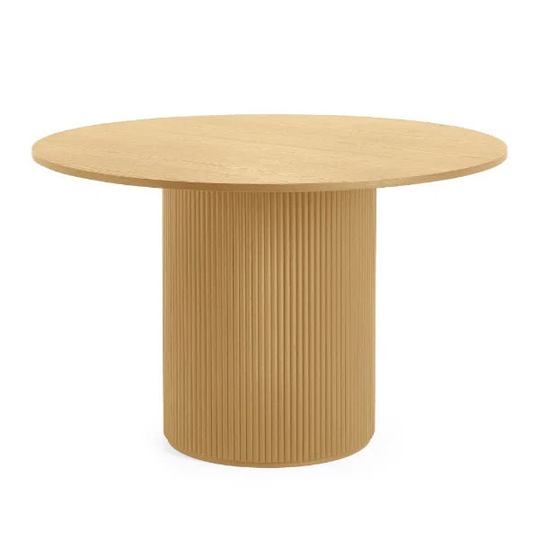 Louis fluted light oak round dining table in a contemporary dining room setting