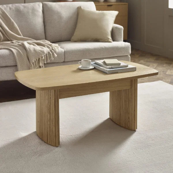 Louis fluted light oak compact coffee table in a modern living room setting