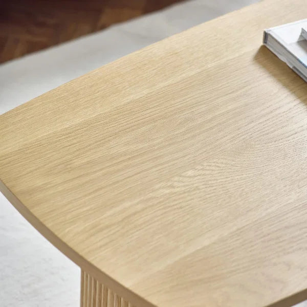 Louis fluted light oak compact coffee table in a modern living room setting