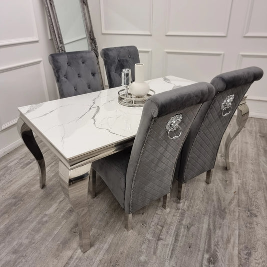 Furnish365 Emma velvet dining chair with scroll top and chrome lion knocker in an elegant dining setting