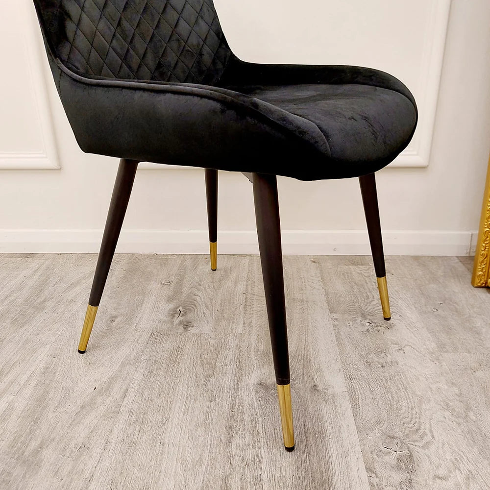 Furnish365 Luna black velvet dining chair in Scandinavian style with cross stitch back detail and gold tipped legs