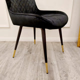 Furnish365 Luna black velvet dining chair in Scandinavian style with cross stitch back detail and gold tipped legs